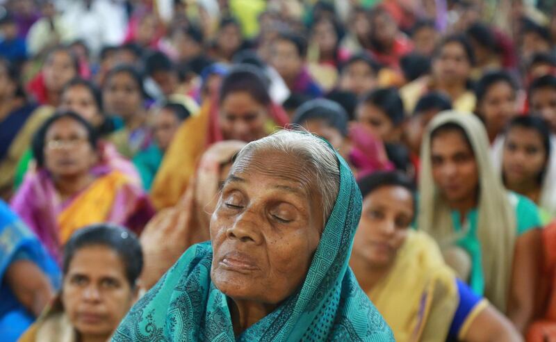 Worshippers attend a Christmas midnight mass at a church in Kochi, India. Sivaram V / Reuters