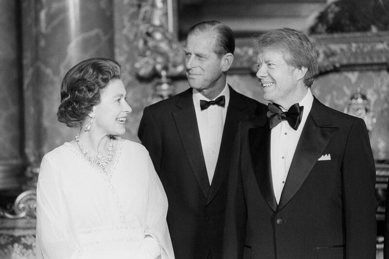 President Jimmy Carter joins Queen Elizabeth II and the Duke of Edinburgh at Buckingham Palace when he and six other world leaders attended dinner in the Blue Drawing Room.   (Photo by PA Images via Getty Images)