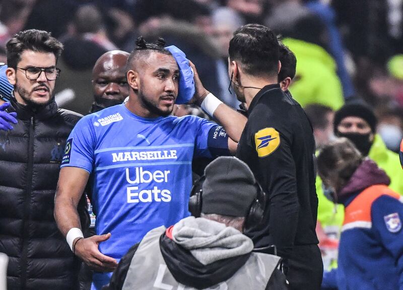 Marseille's French midfielder Dimitri Payet leaves the field after receiving treatment. AFP