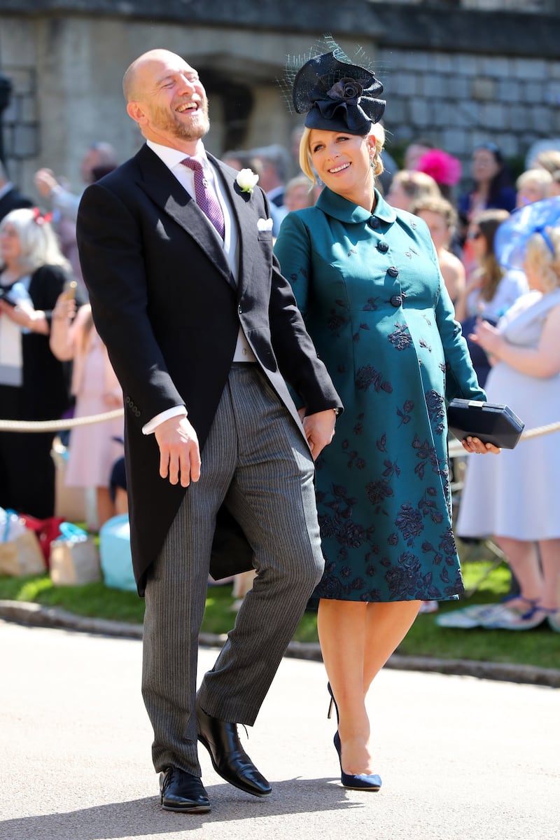 Mike Tindall and Zara Tindall, wearing a teal and black dress, arrive at St George's Chapel at Windsor Castle before the wedding of Prince Harry and Meghan Markle on May 19, 2018. Getty Images