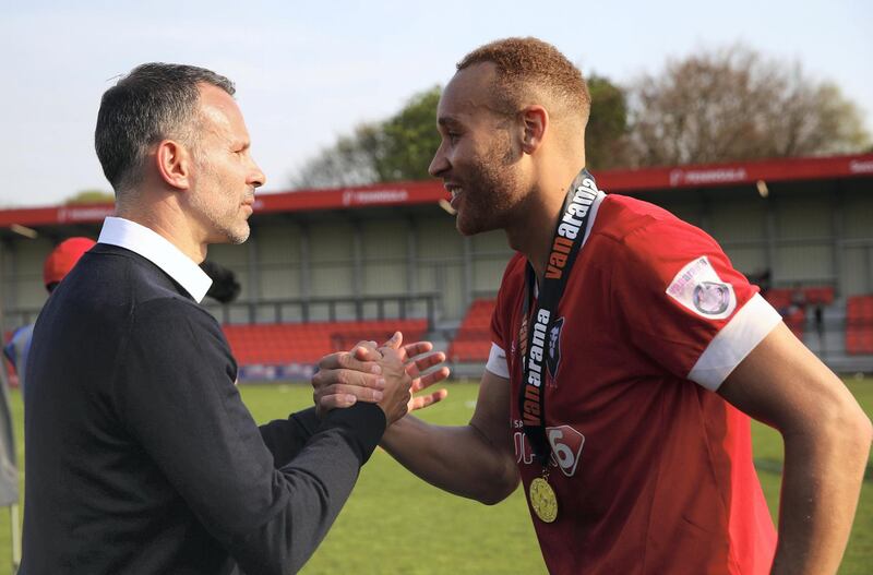 SALFORD, ENGLAND - APRIL 21:  Lois Maynard of Salford City is congratulated by Ryan Giggs co owner of Salford City prior to the official group photo after Salford win the National League North championship during the National League North match between Salford City and Boston at Peninsula Stadium on April 21, 2018 in Salford, England.  (Photo by Clive Brunskill/Getty Images)