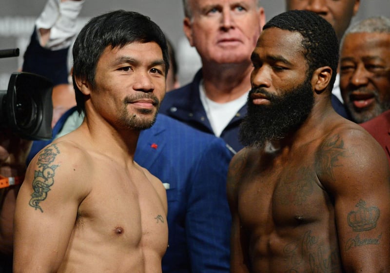 Jan 18, 2019; Las Vegas, NV, USA; Manny Pacquiao (left) and Adrien Broner (right) face off during weigh ins for a WBA welterweight world title boxing match at MGM Grand Garden Arena. Mandatory Credit: Joe Camporeale-USA TODAY Sports