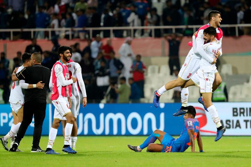 Bahrain's players celebrate after winning the football match against India. AFP