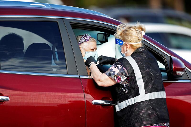 A Florida Department of Health medical worker prepares to administer a COVID-19 vaccine in the parking lot of the Gulf View Square Mall in New Port Richey near Tampa, Florida. Reuters