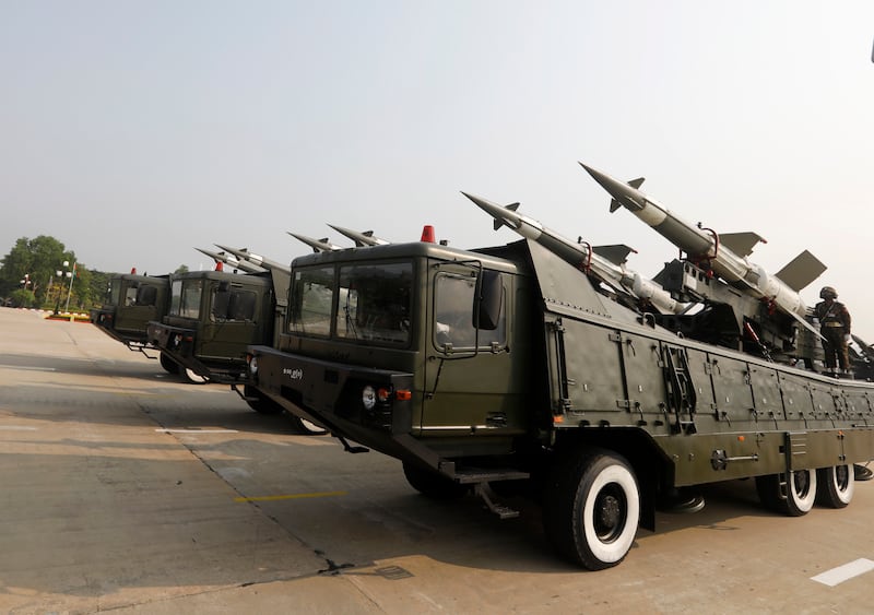 Myanmar soldiers stand on military vehicles during a parade commemorating the 77th Armed Forces Day in Naypyidaw Myanmar. EPA