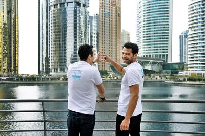 Kerem Kuyucu, right, and AliCagatay Ozcan, founders of Justmop, laugh while posing for photos outside their office at Jumeirah Lake Towers, Dubai, UAE, Wednesday, Feb. 12, 2020. The two have now transformed their marketplace into a super app and expanded into 4 GCC countries. Photos by Shruti Jain The National