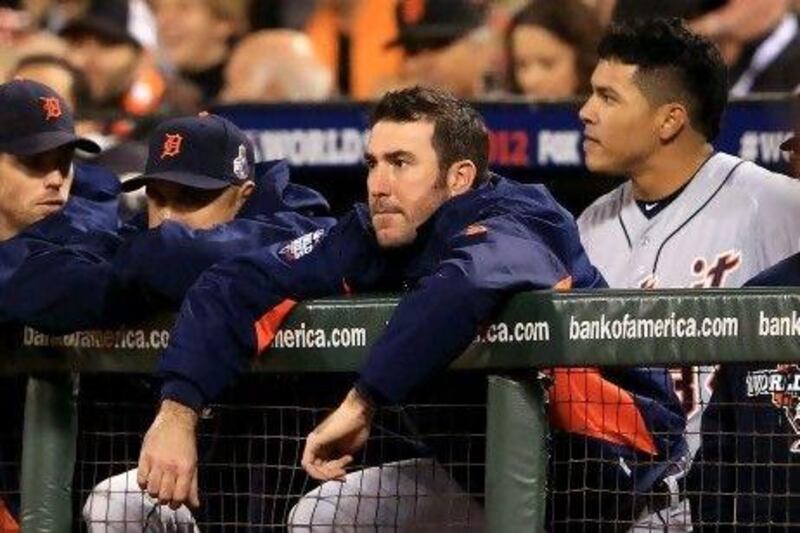 Justin Verlander watches from the dugout as the Tigers take on San Francisco Giants.