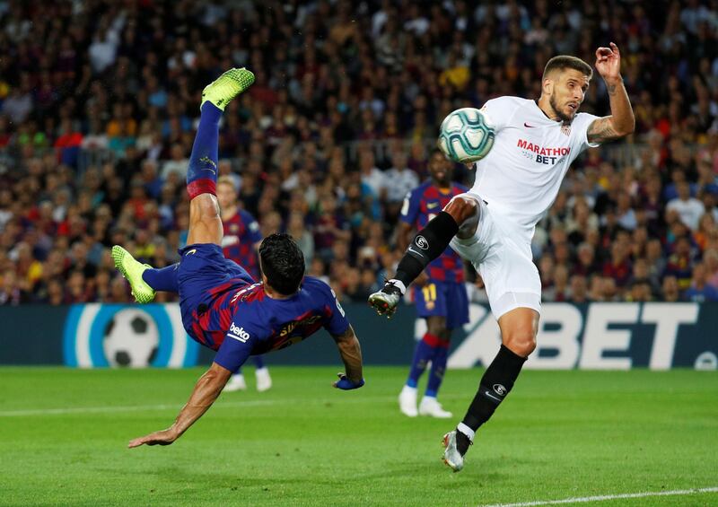 Barcelona's Luis Suarez scores a spectacular overhead kick against Sevilla in La Liga on Sunday, October 6. Reuters