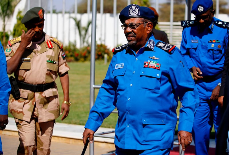 Sudanese President Omar al-Bashir arrives to meet with police officials at the headquarters of the "police house" in the capital Khartoum on December 30, 2018. Sudan's top Islamist party, a member of President Bashar el-Bashir's government, called on December 26 for a probe into the killings of protesters in demonstrations that have rocked the economically troubled country. Angry crowds have taken to the streets in Khartoum and several other cities since December 19 when the government tripled the price of bread.
 / AFP / ASHRAF SHAZLY

