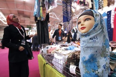 A visitor looks at Muslim women headwear inside an exhibition hall near Paris. Reuters