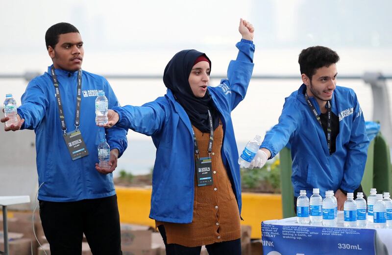 Abu Dhabi, United Arab Emirates - December 06, 2019: Water and energy drinks are handed out in the ADNOC Abu Dhabi marathon 2019. Friday, December 6th, 2019. Abu Dhabi. Chris Whiteoak / The National