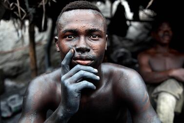 Blue Hand -This man is enslaved in illegal gold mining in Ghana. They are forced to spend 48 to 72 hours deep in the mines shafts.