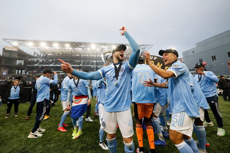 New York City defender Maxime Chanot and midfielder Tony Rocha celebrate with the MLS Cup. USA TODAY