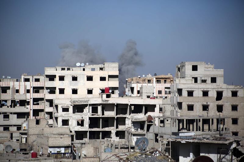 Smoke billows over Kafar Batna.  Ammar Suleiman /  AFP Photo