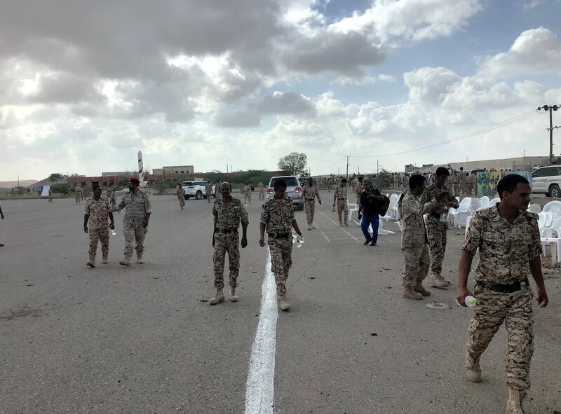 Soldiers inspect the scene of a Houthi drone attack at Yemeni government military parade in al-Anad air base, Lahaj province, Yemen January 10, 2019. REUTERS/Stringer NO RESALES. NO ARCHIVE