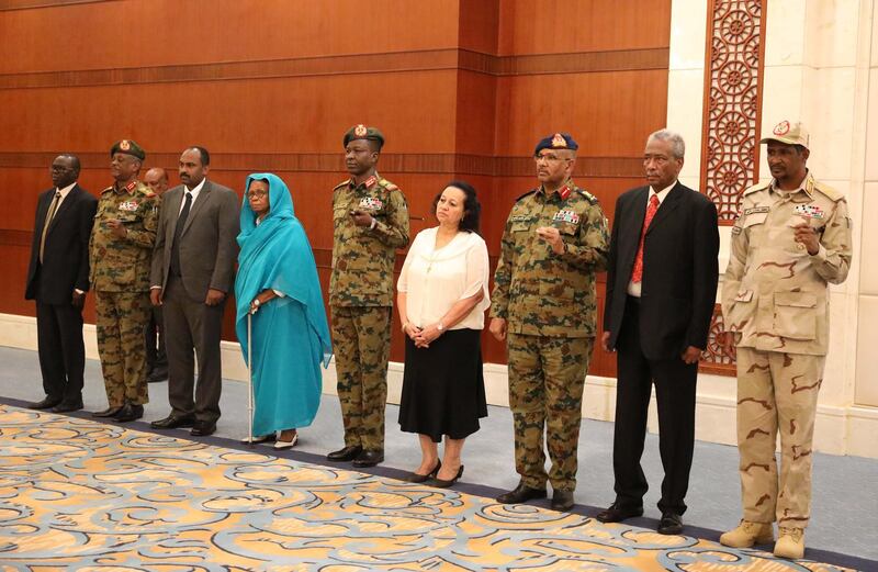 epa07784051 Members of Sudan's newly formed transitional Council (R-L) General Mohamed Hamdan Dagalo, Hassan Sheikh Idris, Genereal Ibrahim Jaber, Raja Nicola Issa Abdul-Masseh, General Shams al-Din Kabashi, Aisha Moussa, Mohamed Alfaki, General Yasser al-Atta and Sadeek Tawer look on during their sweaing-in ceremony at the presidential palace in Khartoum, Sudan, 21 August 2019. The Sudanese opposition and military council signed on 17 August a power sharing agreement. The agreement sets up a sovereign council made of five generals and six civilians, to rule the country until general elections. Protests had erupted in Sudan at the end of 2018, culminating in a long sit-in outside the army headquarters which ended with more than one hundred people being killed and others injured. Sudanese President Omar Hassan al-Bashir stepped down on 11 April 2019.  EPA/MORWAN ALI