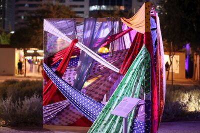 'A Prayer' by Maitha Hamdan, interlaces prayer veils in a box frame installation to depict the strength of unity and love for her Emirati roots. Khushnum Bhandari/ The National