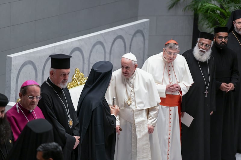 Pope Francis greets his fellow priests at the Cathedral of Our Lady of Arabia, Bahrain. Khushnum Bhandari / The National

