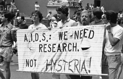 People demanding more support for HIV and Aids research march down Fifth Avenue in New York, in 1983. More than 36 million have died globally since the HIV/Aids epidemic first came to light in the 1980s. AP