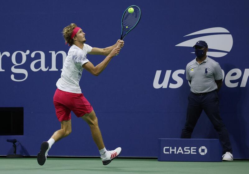 Alexander Zverev hits a return to Dominic Thiem.