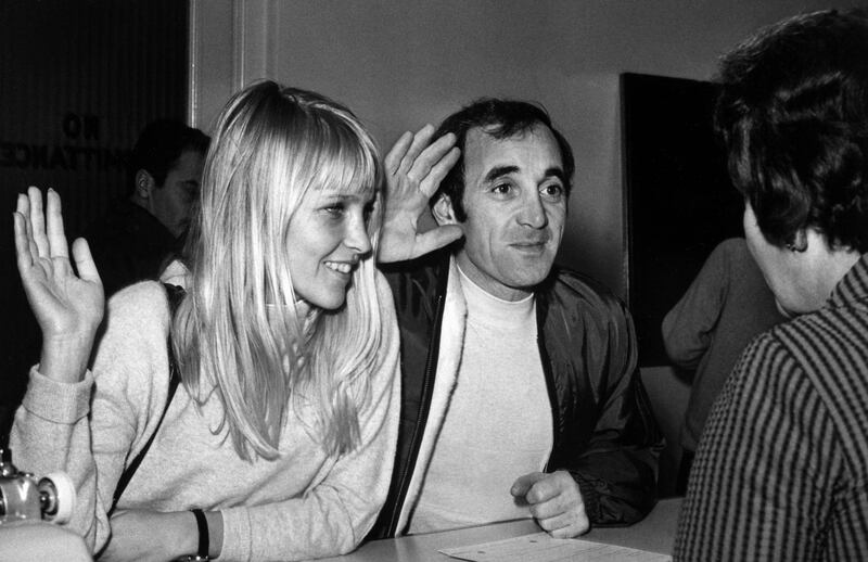 In this photo taken on January 5, 1967 French singer Charles Aznavour and Swedish model Ulla Thorssel swear in during their wedding ceremony in Las Vegas, on January 5, 1967 AFP