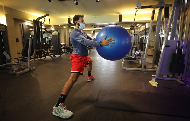 People train at a gym after its reopening in Cairo, Egypt.  EPA