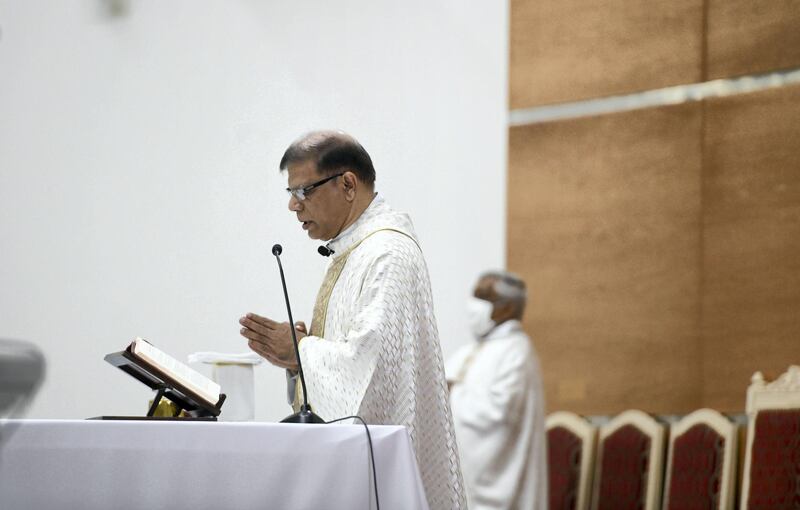 Abu Dhabi, United Arab Emirates - Father Cardoza conducts midnight mass at St. PaulÕs Catholic Church in Mussafah. Khushnum Bhandari for The National