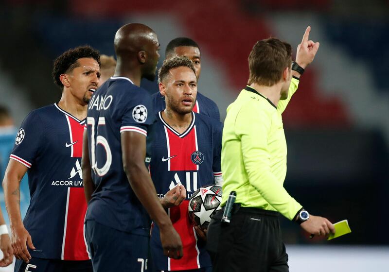 Soccer Football - Champions League - Semi Final First Leg - Paris St Germain v Manchester City - Parc des Princes, Paris, France - April 28, 2021 Paris St Germain's Neymar and Marquinhos remonstrate with referee Felix Brych as Kevin De Bruyne was shown a yellow card REUTERS/Benoit Tessier