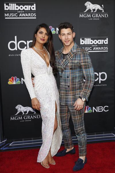 epa07541613 Indian singer Priyanka Chopra (L) and US singer Nick Jonas (R) arrive for the 2019 Billboard Music Awards at the MGM Grand Garden Arena in Las Vegas, Nevada, USA, 01 May 2019. The Billboard Music Awards finalists are based on US year-end chart performance, sales, number of downloads and total airplay.  EPA/NINA PROMMER