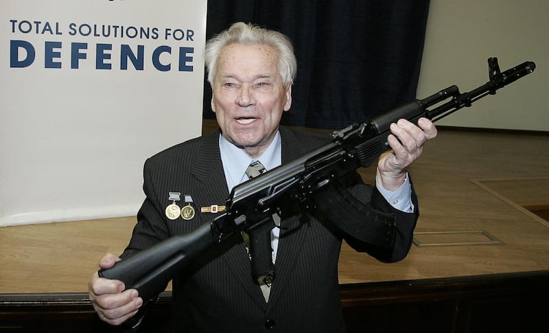 Mikhail Kalashnikov, the Russian inventor of the AK-47 assault rifle, who died on Monday, holds an AK-103 while he poses for a picture in Moscow in 2006. AFP PHOTO / MAXIM MARMUR

