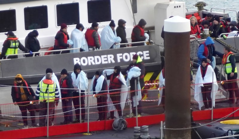 A group of people thought to be migrants are brought in to Dover, Kent, on board a Border Force vessel following a small boat incident in the Channel. PA