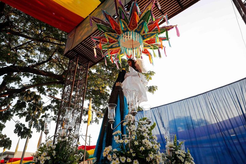 A child removes the black veil from the Virgin Mary during 'Salubong' in Santo Tomas, Pampanga, Philippines. EPA