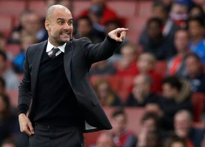 FILE - This is a Sunday, April 2, 2017 file photo of Manchester City manager Pep Guardiola as he gestures during the English Premier League soccer match between Arsenal and Manchester City at the Emirates stadium in London. Itâ€™s been another off season of comings and goings as Manchester City manager Pep Guardiola attempts to deepen his imprint at the Etihad Stadium by spending around $300 million. (AP Photo/Alastair Grant, File)