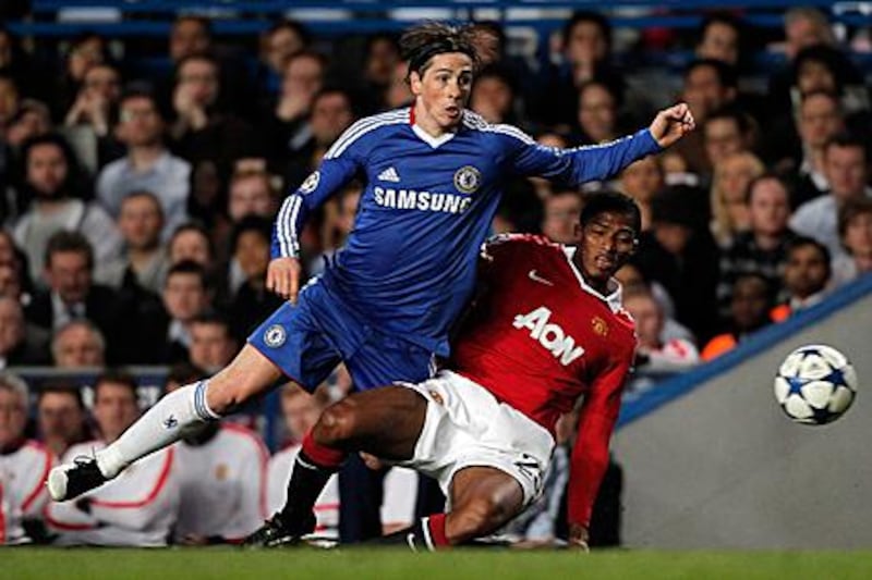 Fernando Torres, left, is yet to score for Chelsea and forced his manager to change the team's formation on three occasions in an effort to accommodate the striker.