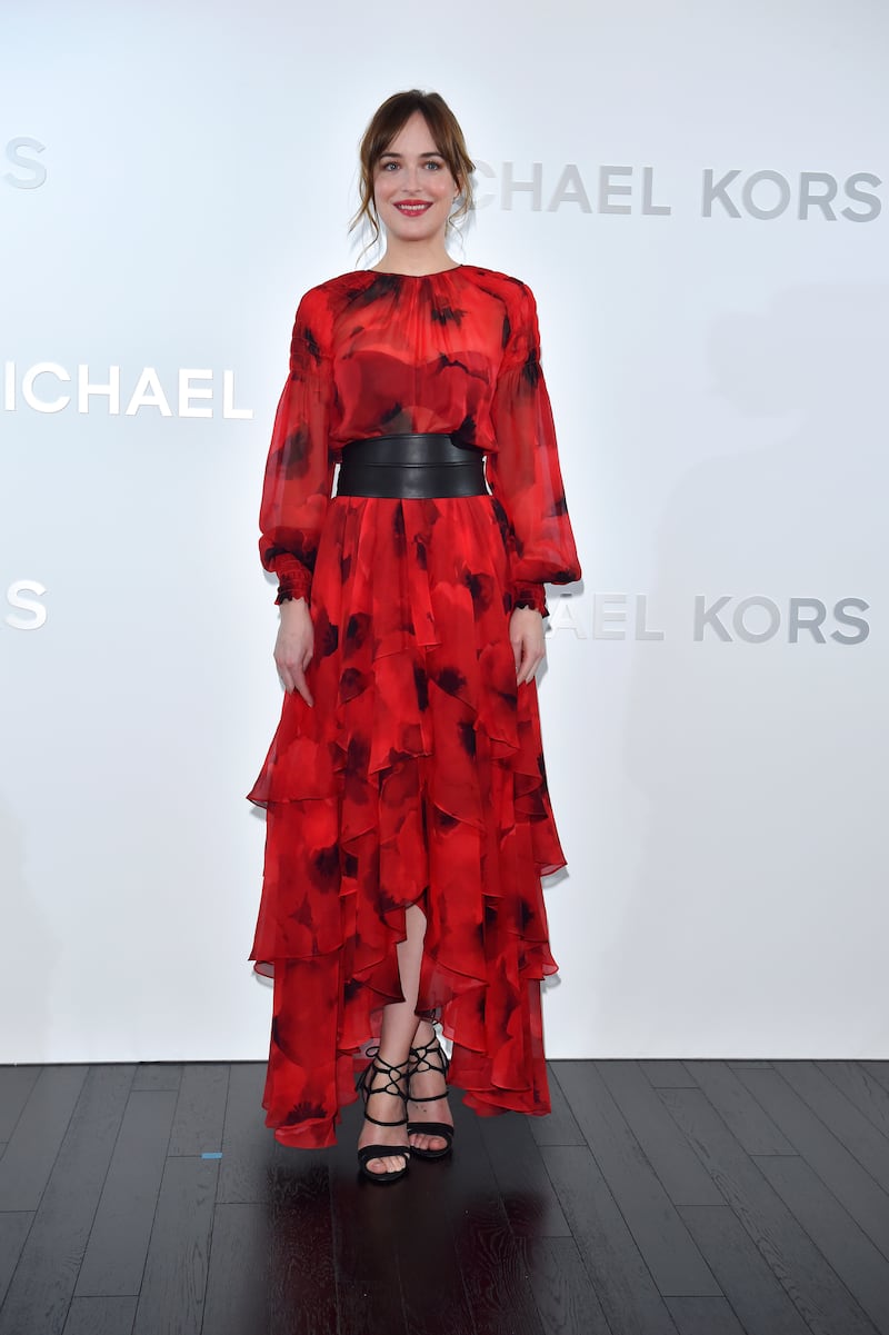 Dakota Johnson, in Michael Kors, attends the opening of the Michael Kors Ginza flagship store on November 20, 2015 in Tokyo, Japan. Getty Images