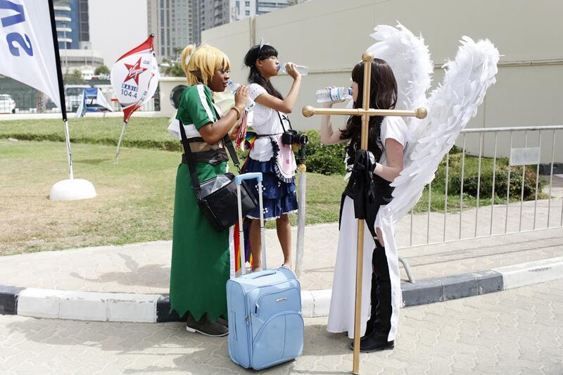 Three ‘characters’ cool off outside the Middle East Film and Comic Con in Dubai last April. Sarah Dea / The National

