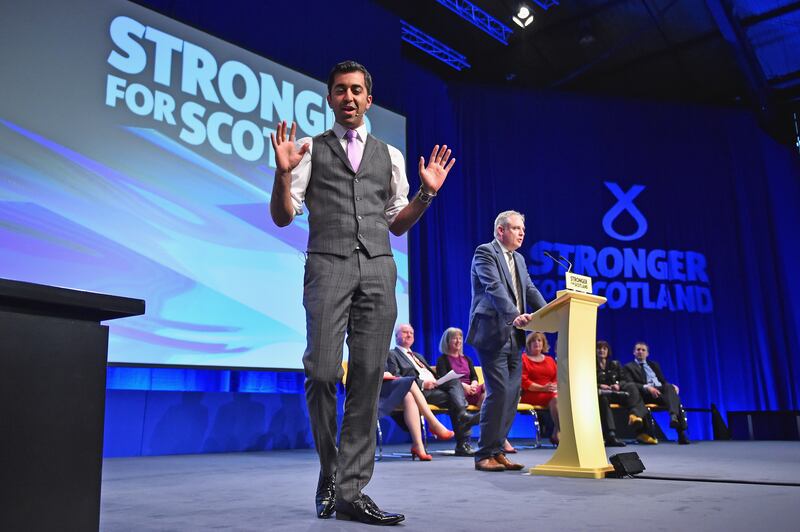 Mr Yousaf speaks during the SNP conference in Aberdeen in 2015. Getty Images