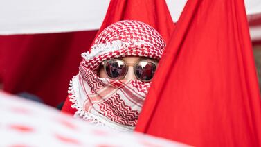 A participant in the Revolutionary May Day Demonstration in Berlin wearing a Palestinian keffiyeh. Getty images