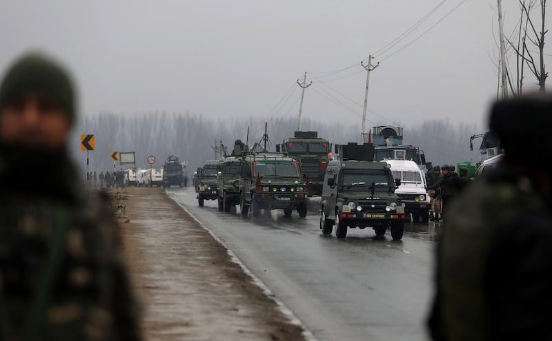 Indian security forces vehicles drive to the site of an attack on a paramilitary Central Reserve Police Force (CRPF) convoy that killed at least 16 troopers and injured several others near Awantipora town, about 30 kms South of Srinagar, in Lethpora. AFP