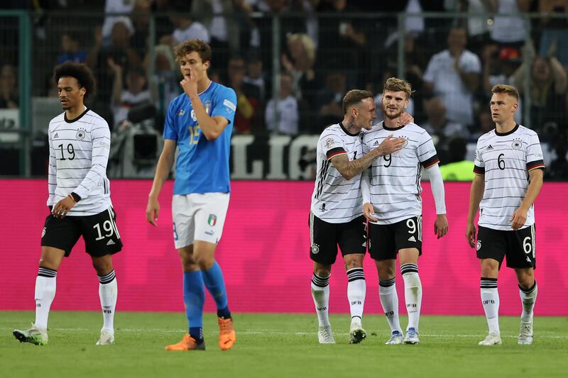 Timo Werner celebrates scoring the fifth goal with teammate David Raum. Getty