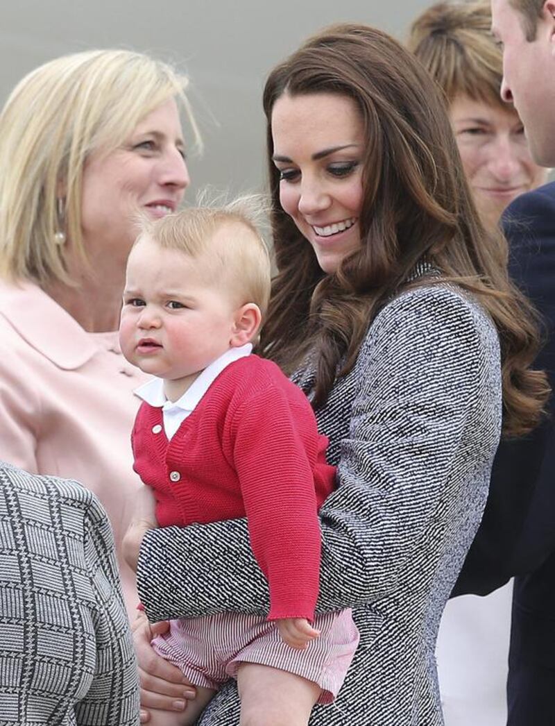Kate, the Duchess of Cambridge, holds Prince George as they say goodbye before they board their flight in Canberra, Australia. Rob Griffith / AP photo