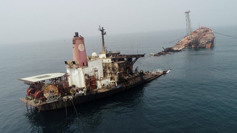 Wreckage of the 'FPSO Trinity Spirit' succumbs slowly to the waves after an explosion and fire broke out at Shebah Exploration & Production Company's offshore production facility on Wednesday, at Warri in Nigeria. Reuters