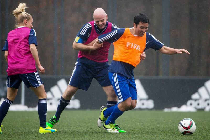 New Fifa president Gianni Infantino (L) fights for the ball with Deco of Portugal during a Fifa Team Friendly Football Match at the Fifa headquarters on February 29, 2016 in Zurich, Switzerland. (Photo by Philipp Schmidli/Getty Images)