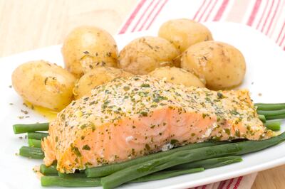 Grilled salmon fillet with French beans and new potatoes - studio shot