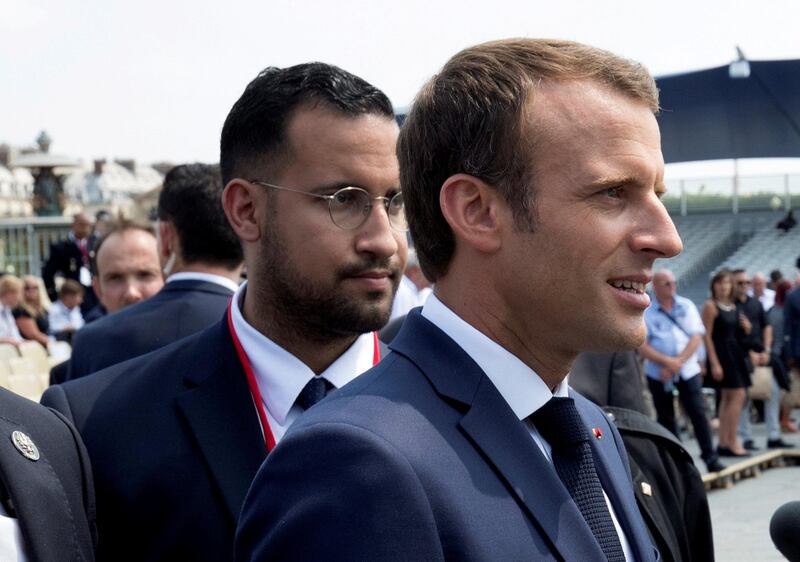 FILE PHOTO: French President Emmanuel Macron walks ahead of his aide Alexandre Benalla at the end of the Bastille Day military parade in Paris, France, July 14, 2018.  Picture taken July 14, 2018.  REUTERS/Philippe Wojazer/File Photo