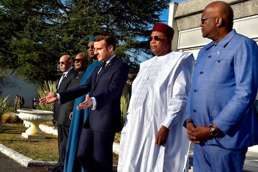 President Macron and the leaders of the G5 Sahel group lay a wreath in memory of French soldiers killed in a helicopter collision last year. AFP