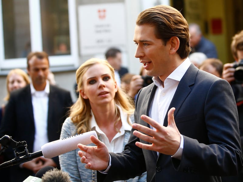 Top candidate of Peoples Party (OeVP) and Foreign Minister Sebastian Kurz talks with journalist after leaving a polling station in Vienna, Austria October 15, 2017. REUTERS/Leonhard Foeger