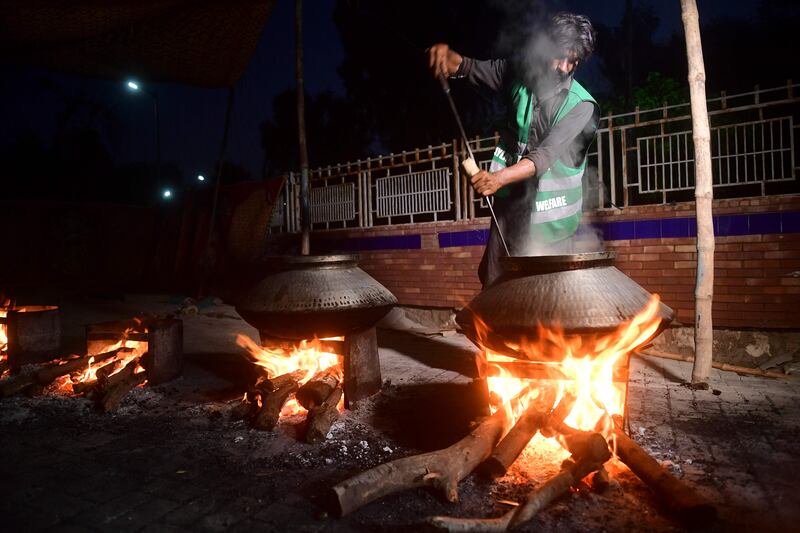 A cook prepares food for displaced people at a centre run by charity Saylani Welfare in Sukkur, Sindh province. AFP