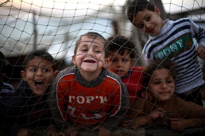 Palestinian children play at the Shati refugee camp in Gaza City. Mohammed Abed / AFP