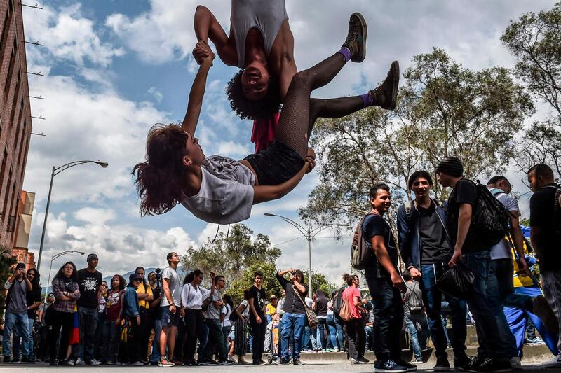 University students demonstrate against the crisis in the public education, budget cuts and a tax reform project announced by the government of Ivan Duque in Medellin, Colombia.  AFP